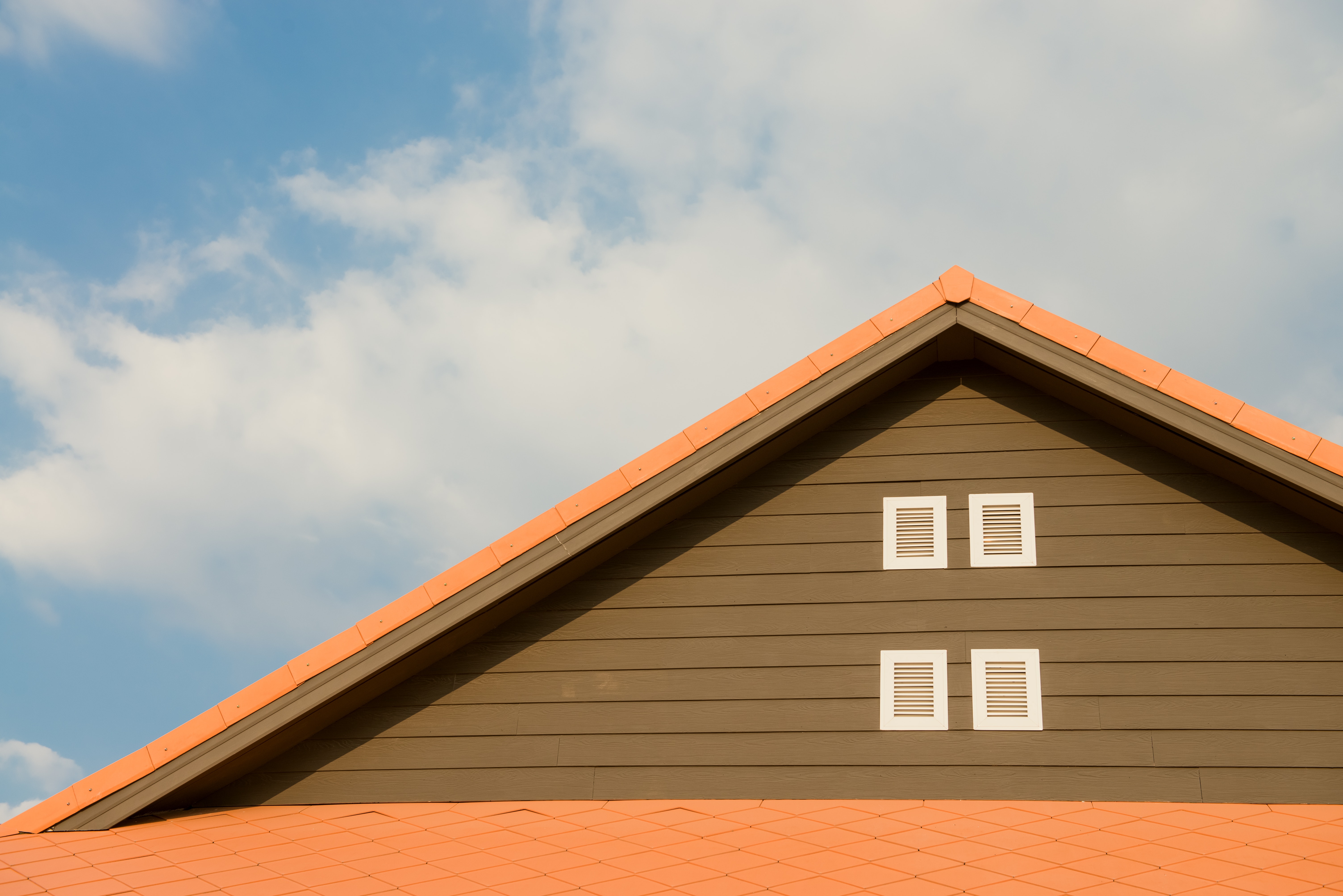 orange-and-gray-painted-roof-under-cloudy-347152.jpg